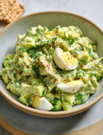 Herby avocado egg salad bowl with fresh herbs and eggs
