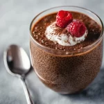 High protein chocolate chia seed pudding topped with fresh berries