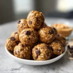 No-bake peanut butter energy bites ready to eat as a nutritious snack.