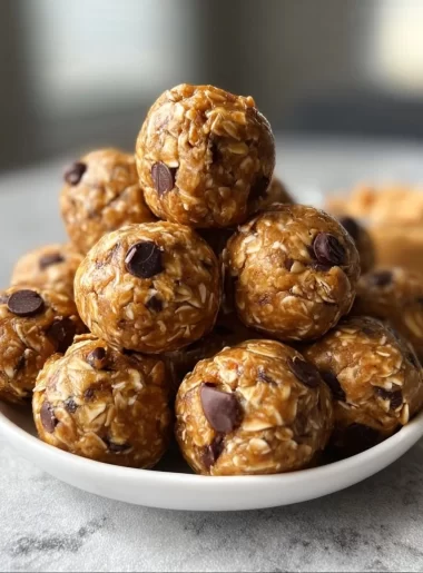 No-bake peanut butter energy bites ready to eat as a nutritious snack.