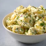 Bowl of fresh South African potato salad with herbs and spices