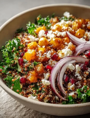 A colorful Winter Mediterranean Quinoa Bowl filled with fresh vegetables and quinoa.