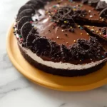 Delicious 3-Ingredient TikTok Oreo Cake topped with crushed Oreos.