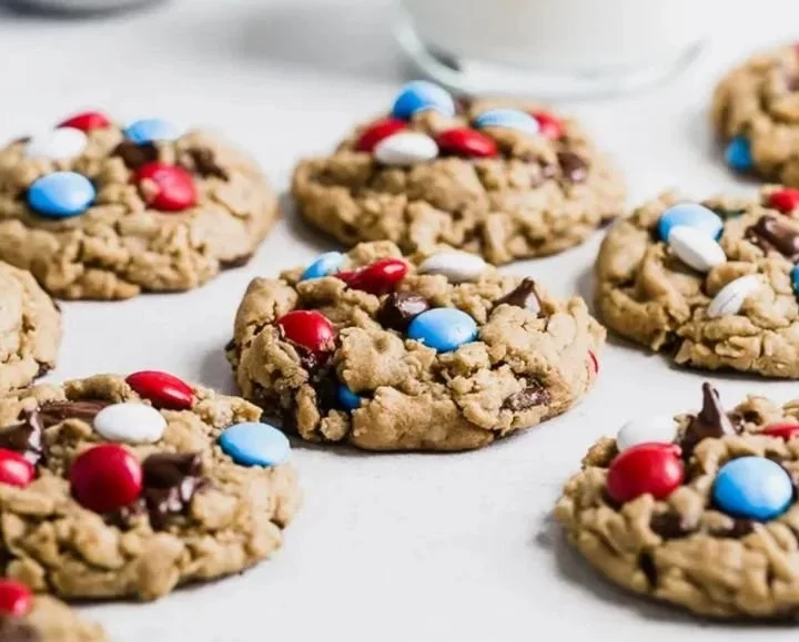 Colorful 4th of July Monster Cookies with festive sprinkles and chocolate chips.
