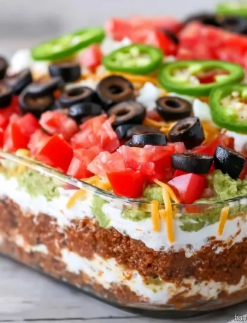 American Flag Layered Taco Dip with colorful layers for festive gatherings.