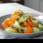 Carrot and cucumber ribbon salad with fresh vegetables and herbs