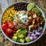 Delicious Chicken Taco Bowl with Brown Rice topped with fresh ingredients