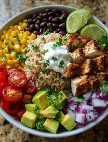 Delicious Chicken Taco Bowl with Brown Rice topped with fresh ingredients