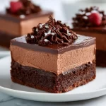 Delicious chocolate mousse brownies topped with creamy mousse layer.
