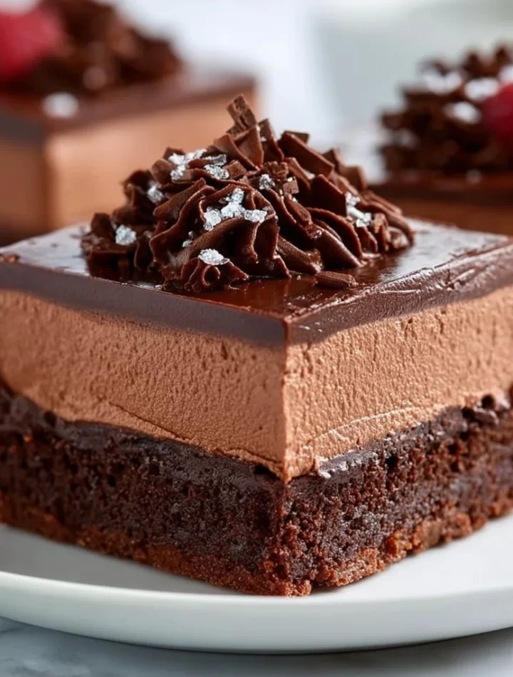 Delicious chocolate mousse brownies topped with creamy mousse layer.