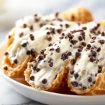 Delicious creamy cannoli dip served with crispy waffle cones
