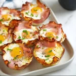 Ham and Cheese Egg Cups served on a plate