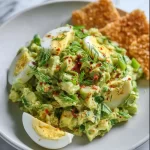 Herby Avocado Egg Salad served in a bowl with fresh herbs