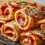 High protein pepperoni pizza rolls on a plate, ready to eat.