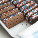 Patriotic ice cream sandwiches decorated with red, white, and blue colors.
