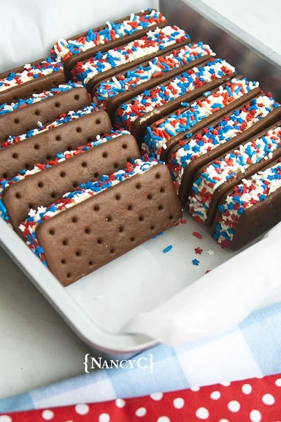 Patriotic ice cream sandwiches decorated with red, white, and blue colors.