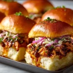 Delicious BBQ chicken sliders served on a platter