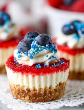 Red, white, and blue mini cheesecakes topped with berries for a patriotic dessert