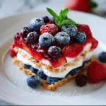 Red White & Blue Mixed Berry dessert topped with fresh berries