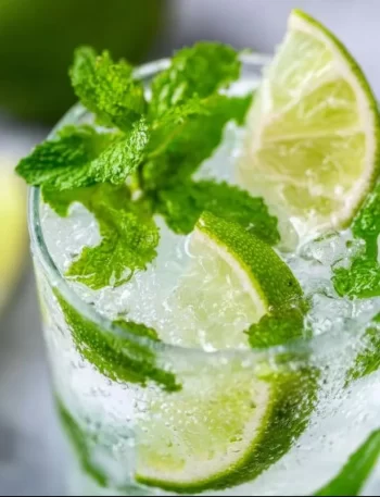 Refreshing mojito recipe ingredients and serving in a glass.