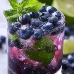 Delicious blueberry mojito garnished with fresh blueberries and mint leaves