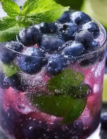 Delicious blueberry mojito garnished with fresh blueberries and mint leaves