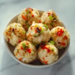 A plate of colorful veggie rice balls made from fresh vegetables and rice