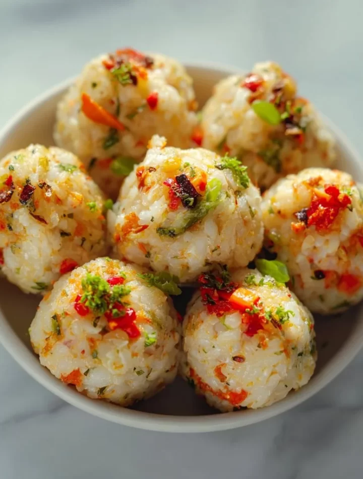 A plate of colorful veggie rice balls made from fresh vegetables and rice
