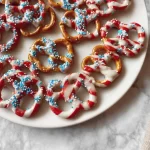 Delicious 4th of July Flag Pretzels decorated in red, white, and blue.
