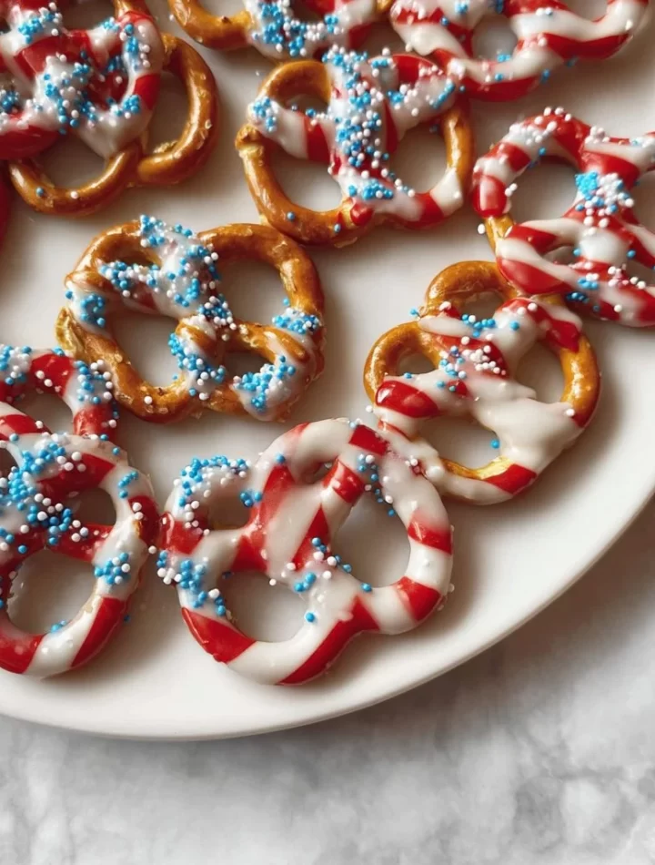 Delicious 4th of July Flag Pretzels decorated in red, white, and blue.