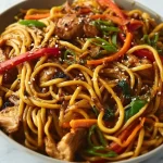Delicious Blackstone Chicken Lo Mein stir-fried with colorful vegetables and noodles.