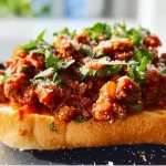 Delicious Blackstone Italian Sloppy Joes served on a plate with toppings.