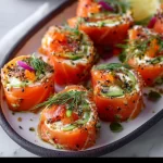 Easy smoked salmon roll ups ready to serve on a platter