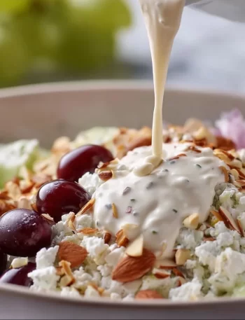 Healthy Greek yogurt salad dressing in a bowl with fresh herbs
