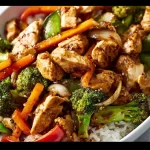 A delicious plate of hibachi chicken and vegetables grilled to perfection.
