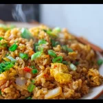 Plate of delicious Hibachi Fried Rice with vegetables and egg