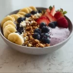 High protein breakfast smoothie bowl with fruits and nuts