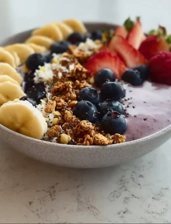 High protein breakfast smoothie bowl with fruits and nuts