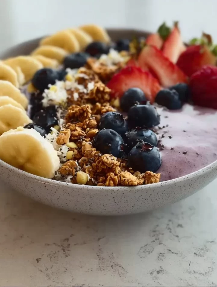 High protein breakfast smoothie bowl with fruits and nuts