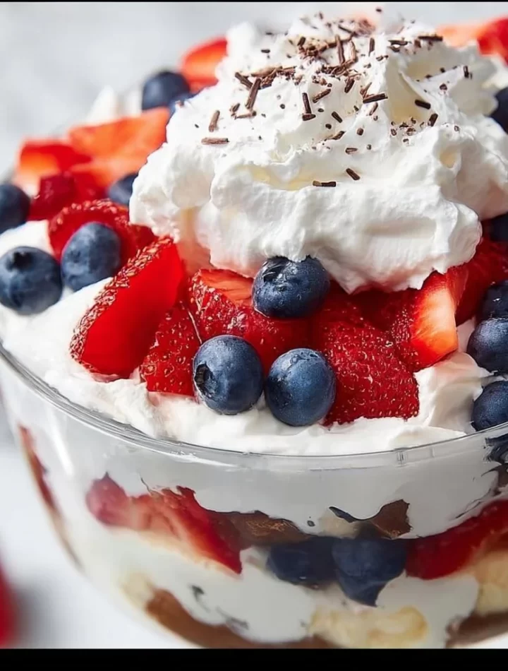Easy 4th of July trifle dessert with layers of fresh berries and whipped cream