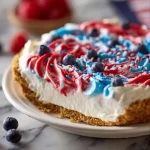 No-bake 4th of July swirl pie with vibrant red, white, and blue layers
