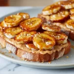 Delicious peanut butter toast topped with caramelized bananas