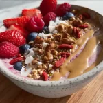 Colorful and nutritious smoothie bowl topped with fresh fruits and seeds