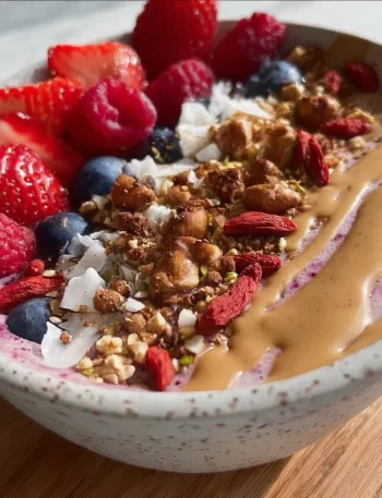Colorful and nutritious smoothie bowl topped with fresh fruits and seeds