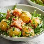 Bowl of quick and healthy salmon potato salad with fresh vegetables