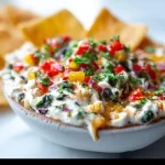 A bowl of refreshing Greek yogurt dip with fresh veggies for summer pool parties.