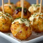 Savory ham and cheese cake pops on a platter ready for serving