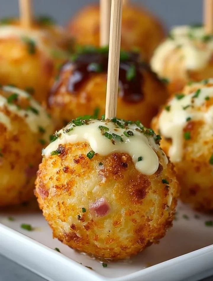 Savory ham and cheese cake pops on a platter ready for serving
