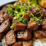Grilled hibachi steak served at a backyard BBQ with vibrant vegetables.