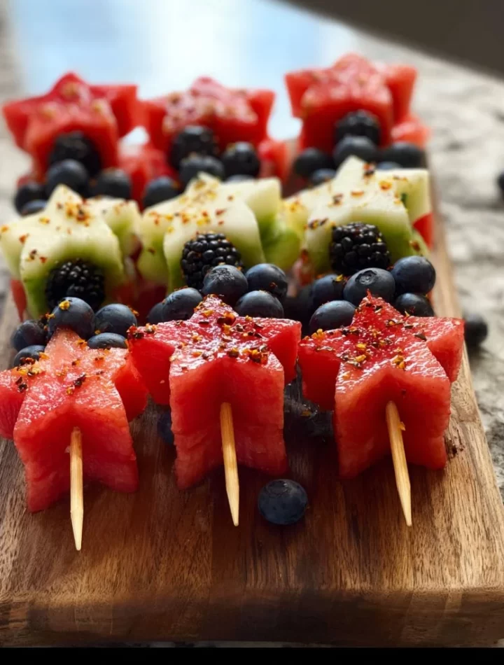 Colorful star-spangled fruit skewers with strawberries, blueberries, and bananas